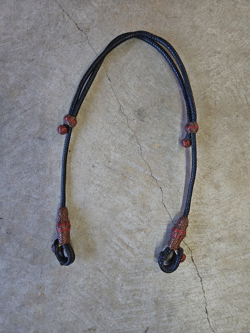 16 Plait Rawhide Bosal Hanger Black with Brown Buttons and Red Accents