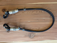 Load image into Gallery viewer, 28 Plait Bosal Hanger Rawhide Black with Natural Buttons and black accents